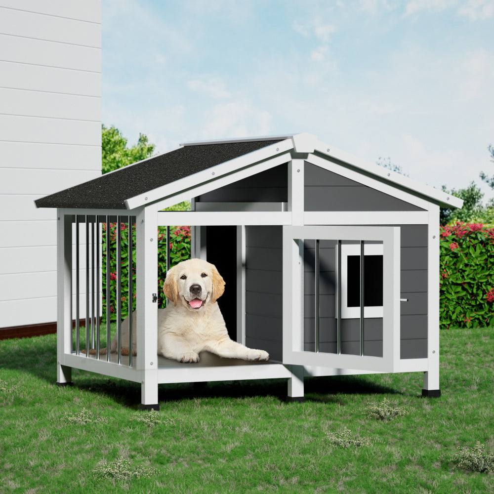 Dog house with a dog inside on a grassy area